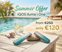 IQOS Iluma i One devices on a table by a pool with promotional text.